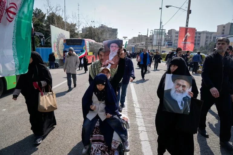 Defiance and Grief as Iranians Hold Friday Prayers Amid Bombing Ruins in Tehran During Ramadan